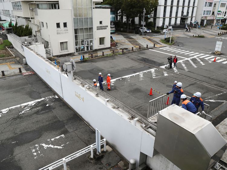 Nagoya port officers close the breakwater gates in Nagoya as Typhoon Jebi hit western Japan