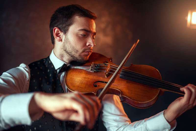 male-fiddler-playing-classical-music-on-violin
