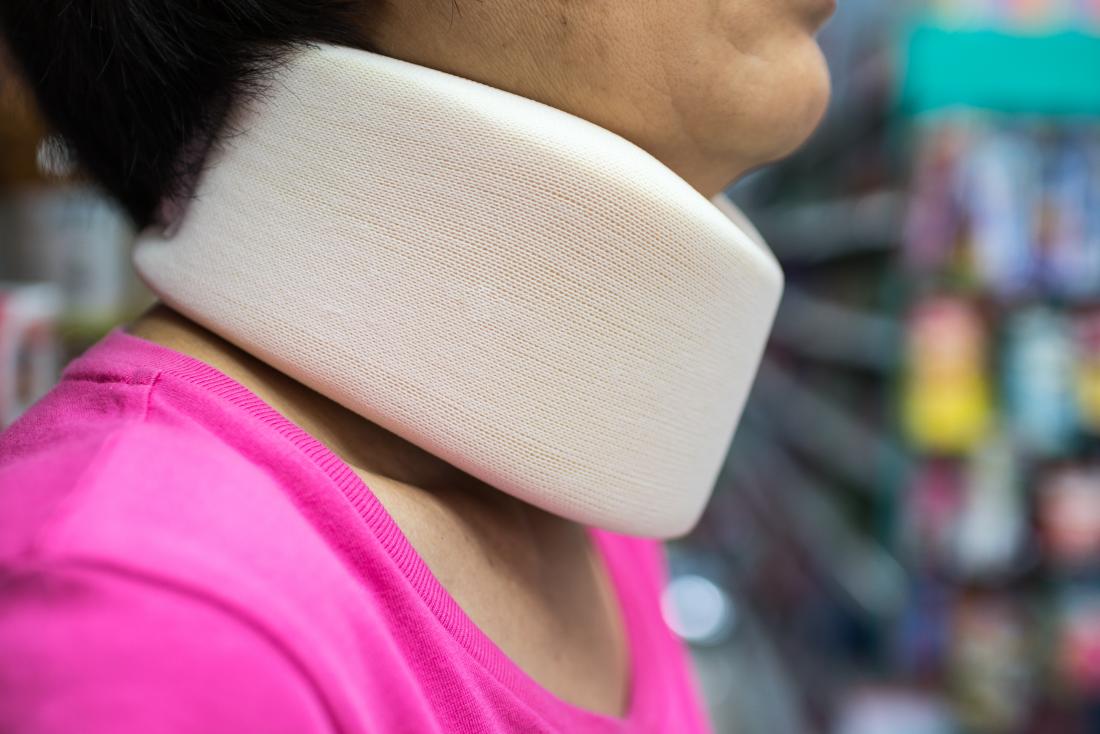 Woman wearing a soft neck brace