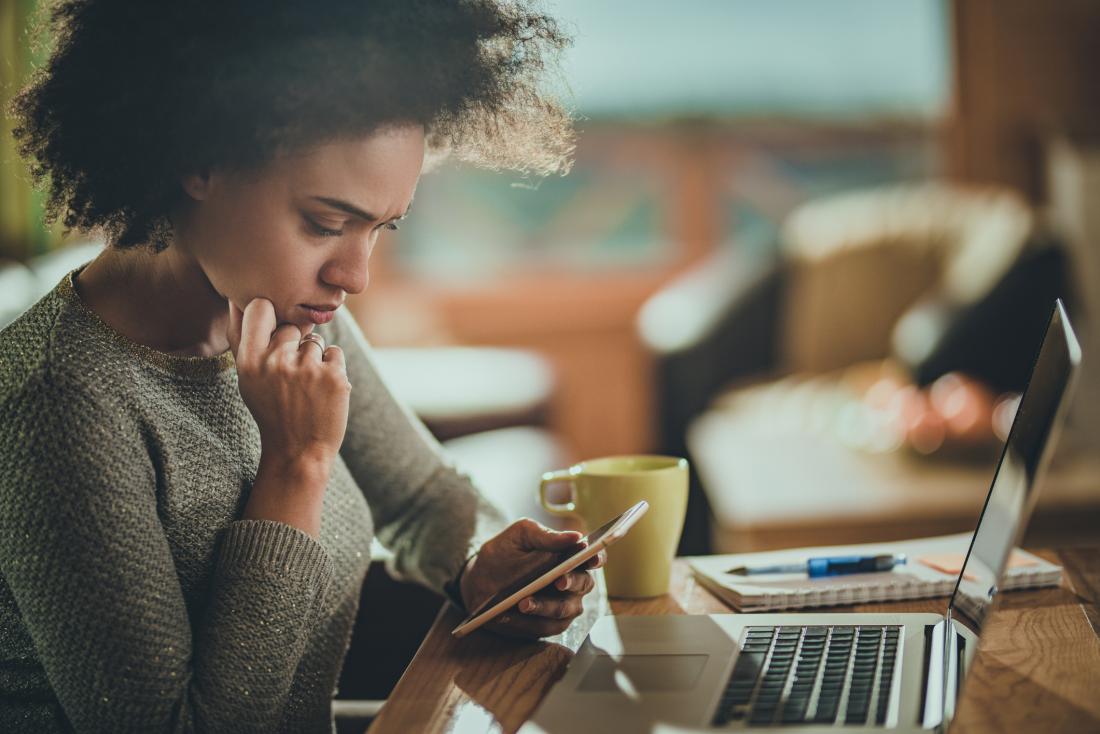 woman looking at her phone