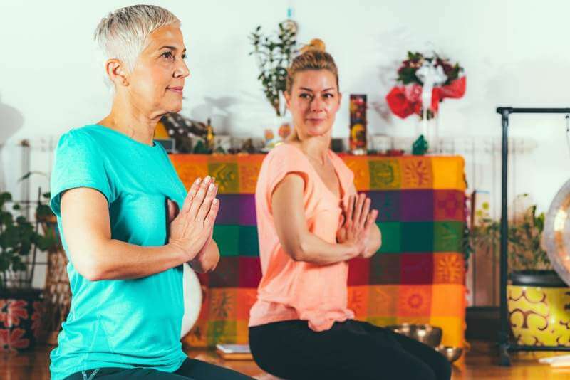 senior-woman-on-private-yoga-class