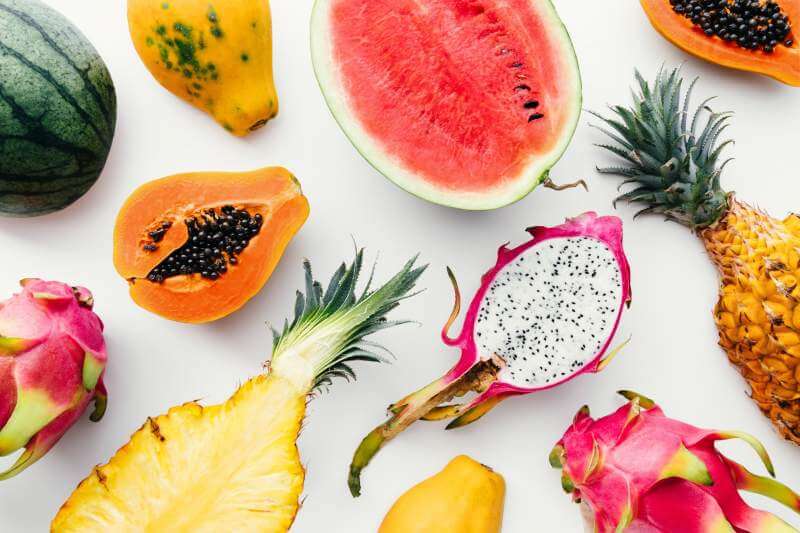 tropical-fruit-layout-made-of-dragon-fruit-watermelon-papaya-and-pineapple