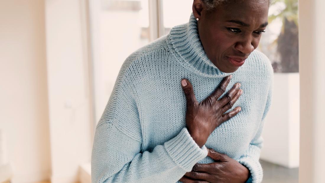 a woman experience acid reflux and shortness of breath