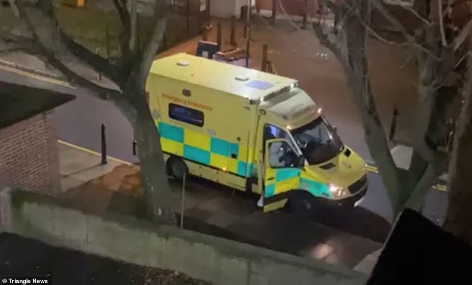 Separate footage taken in the early hours of Monday showed an ambulance worker in a white protective suit outside an address in Spitalfields, east London