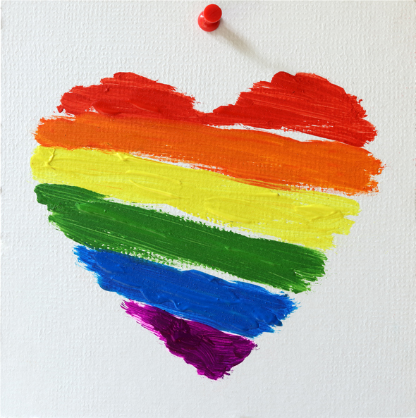 Rainbow flag symbolizing LGBTQ+ community in heart shape